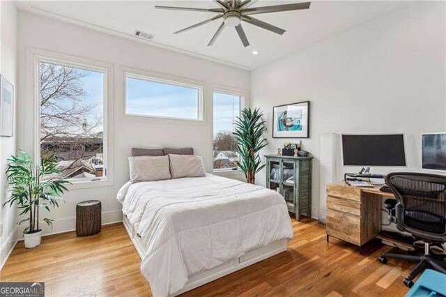 bedroom with visible vents, a ceiling fan, wood finished floors, recessed lighting, and baseboards