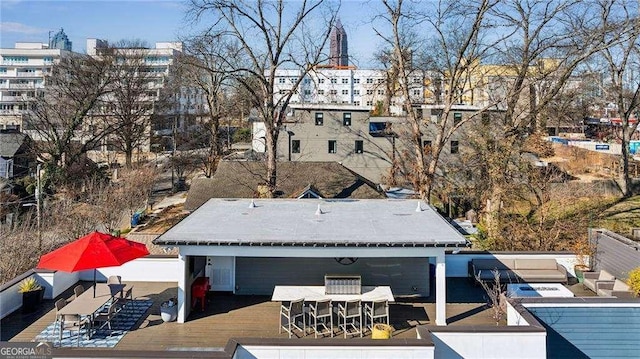 exterior space featuring outdoor dry bar and a wooden deck