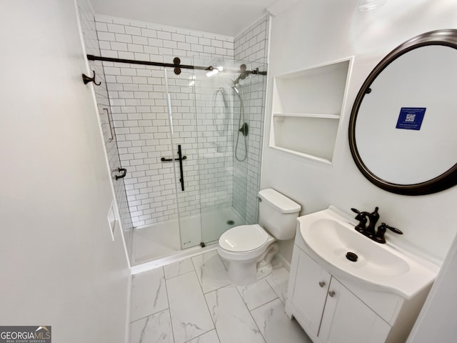 bathroom with vanity, baseboards, a stall shower, toilet, and marble finish floor