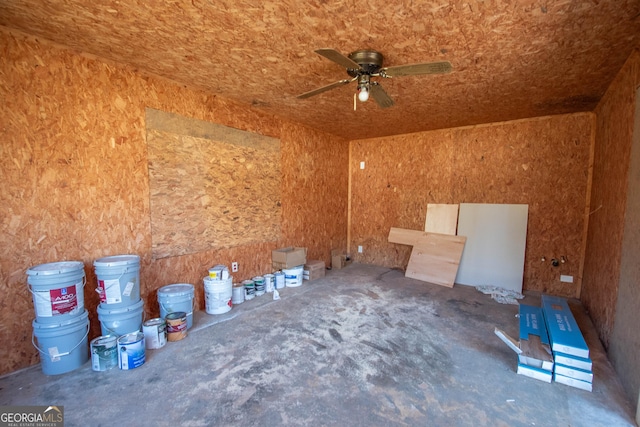 misc room with unfinished concrete floors and a ceiling fan