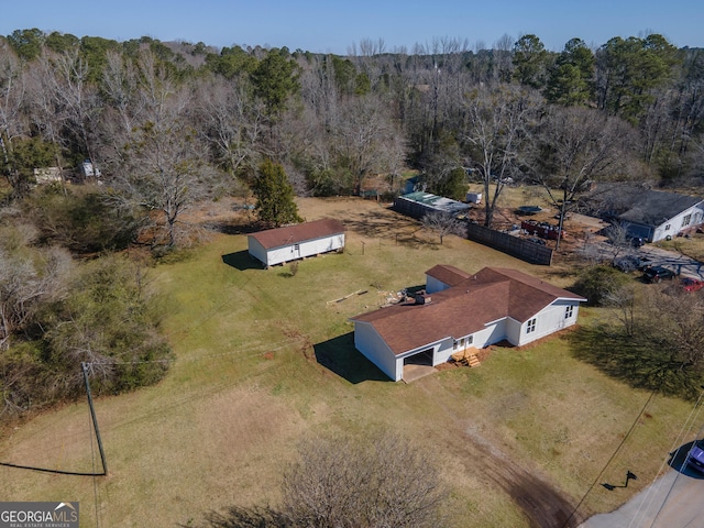 aerial view featuring a view of trees and a rural view