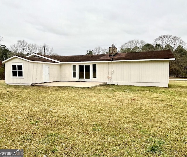 189 Tatum Heights Dr, Lagrange, GA 30240 - rear view of property with a patio area, a chimney, and a lawn