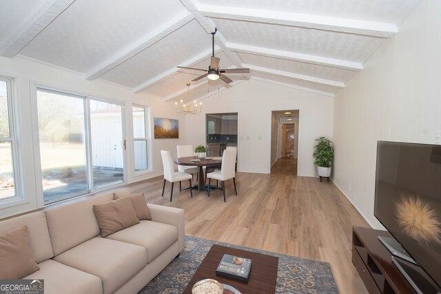 living room featuring light wood-style flooring, vaulted ceiling with beams, and a chandelier