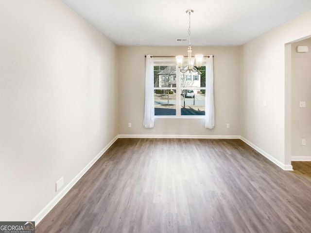 7644 Watson Cir, Locust Grove, GA 30248 - unfurnished dining area with wood finished floors and a chandelier