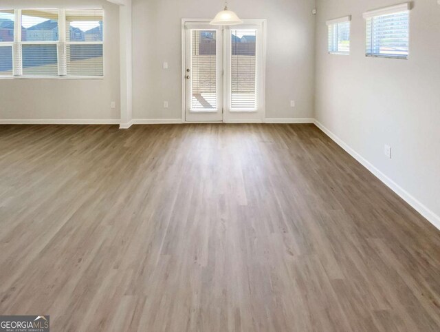 7644 Watson Cir, Locust Grove, GA 30248 - unfurnished room featuring wood finished floors and baseboards