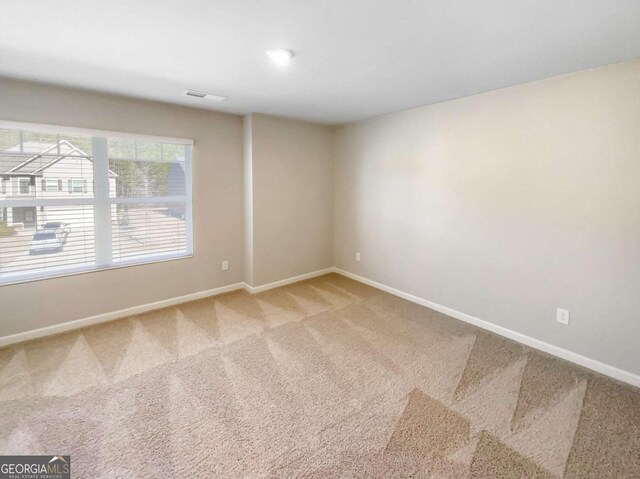 7644 Watson Cir, Locust Grove, GA 30248 - unfurnished room featuring light colored carpet and baseboards