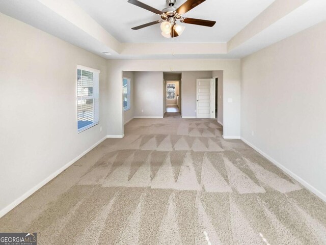 7644 Watson Cir, Locust Grove, GA 30248 - carpeted empty room featuring a ceiling fan and a raised ceiling