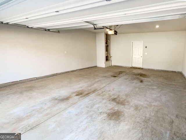 7644 Watson Cir, Locust Grove, GA 30248 - garage with a garage door opener and recessed lighting