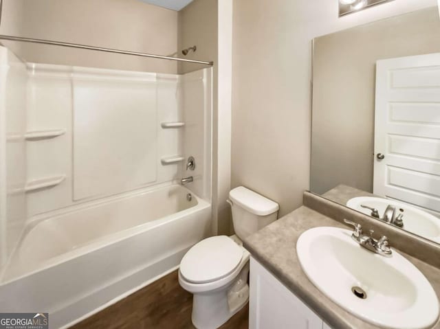 7644 Watson Cir, Locust Grove, GA 30248 - full bathroom featuring shower / washtub combination, vanity, and wood finished floors