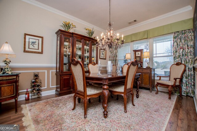 348 N Ridge Ln, Temple, GA 30179 - dining space with wood finished floors, visible vents, crown molding, wainscoting, and a notable chandelier