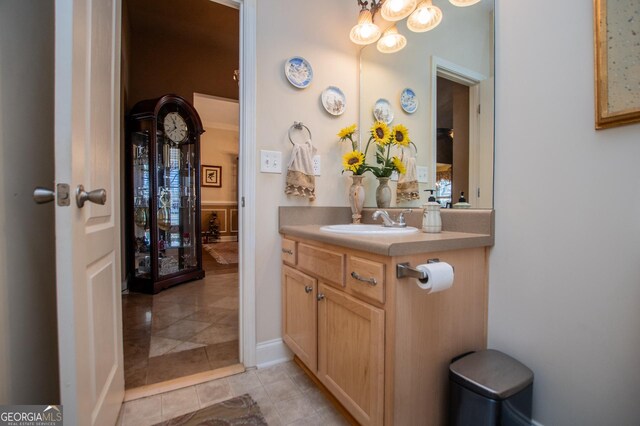 348 N Ridge Ln, Temple, GA 30179 - bathroom featuring tile patterned floors, baseboards, vanity, and a chandelier