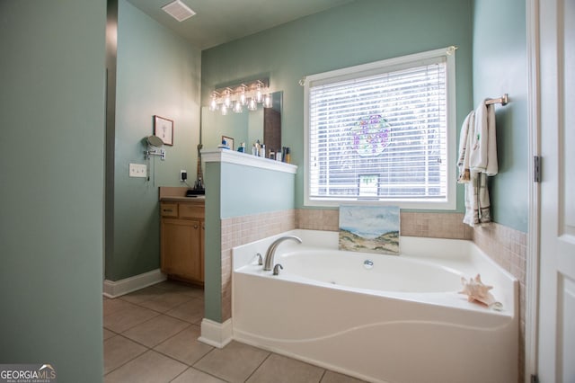 348 N Ridge Ln, Temple, GA 30179 - full bathroom with tile patterned floors, visible vents, vanity, baseboards, and a garden tub