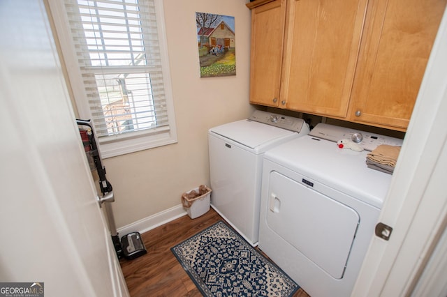 laundry area featuring cabinet space, washing machine and dryer, dark wood-style flooring, and baseboards