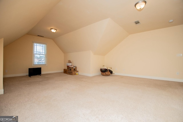 bonus room with carpet flooring, baseboards, lofted ceiling, and visible vents