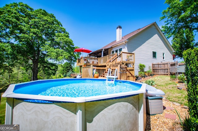 348 N Ridge Ln, Temple, GA 30179 - pool with stairway, a wooden deck, and fence