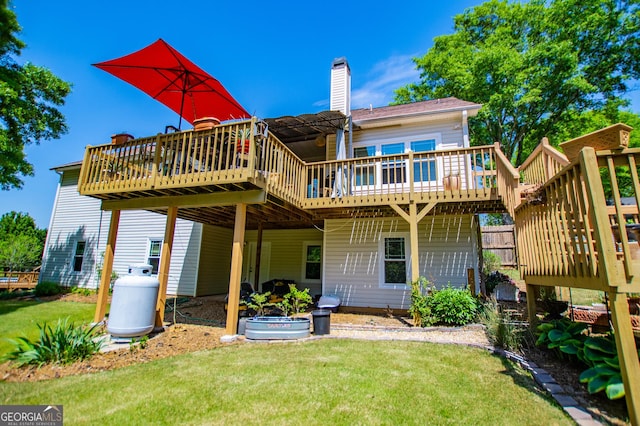 348 N Ridge Ln, Temple, GA 30179 - back of house featuring a wooden deck, a lawn, a chimney, and a pergola