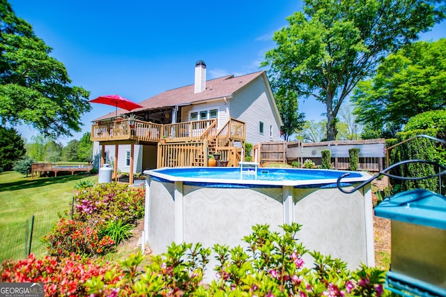 348 N Ridge Ln, Temple, GA 30179 - outdoor pool with fence, a yard, stairs, and a deck