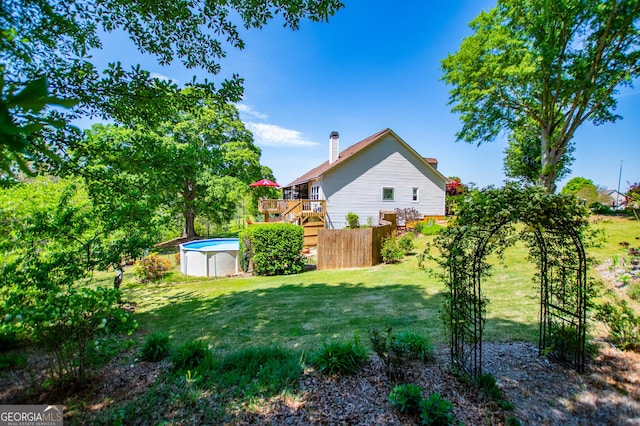 348 N Ridge Ln, Temple, GA 30179 - view of yard with an outdoor pool, stairs, and a deck