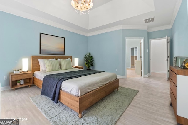 1439 Mill Pointe Ct, Lawrenceville, GA 30043 - bedroom featuring light wood finished floors, a chandelier, and ornamental molding