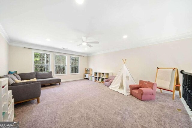 game room featuring ornamental molding, carpet, recessed lighting, and ceiling fan