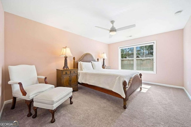 bedroom with baseboards, carpet floors, and a ceiling fan