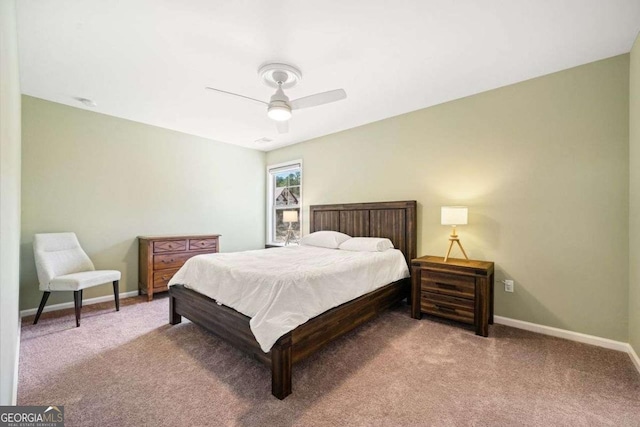 carpeted bedroom with a ceiling fan and baseboards