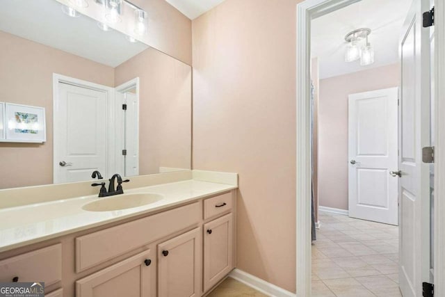 bathroom with vanity and baseboards