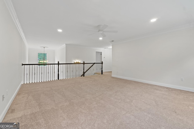 1439 Mill Pointe Ct, Lawrenceville, GA 30043 - unfurnished room with crown molding, ceiling fan, light colored carpet, recessed lighting, and a chandelier