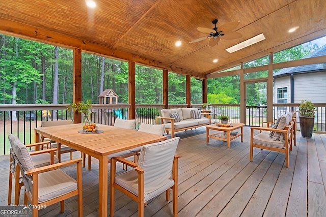 1439 Mill Pointe Ct, Lawrenceville, GA 30043 - sunroom / solarium featuring an outdoor hangout area, a ceiling fan, vaulted ceiling, outdoor dining space, and a skylight