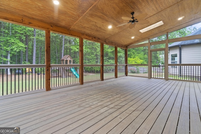 1439 Mill Pointe Ct, Lawrenceville, GA 30043 - unfurnished sunroom featuring a skylight and vaulted ceiling