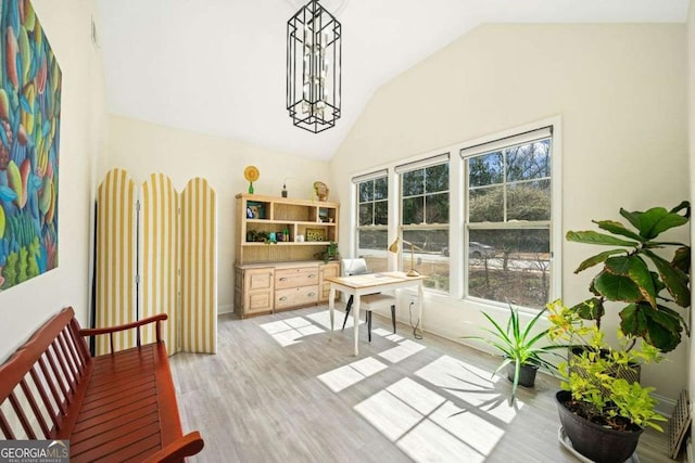 interior space with lofted ceiling and light wood-style floors