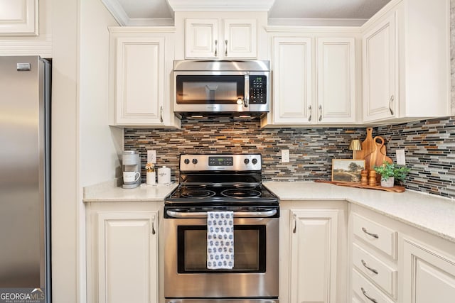 kitchen featuring stainless steel appliances, backsplash, white cabinets, and ornamental molding