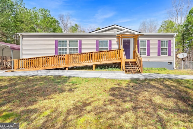 manufactured / mobile home featuring crawl space and a front yard