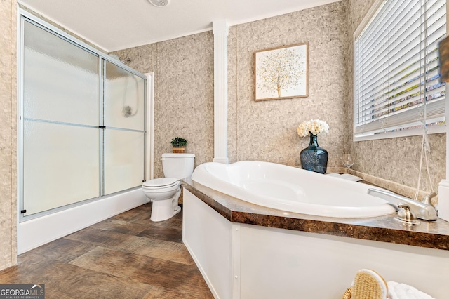 full bath featuring a stall shower, toilet, and a garden tub