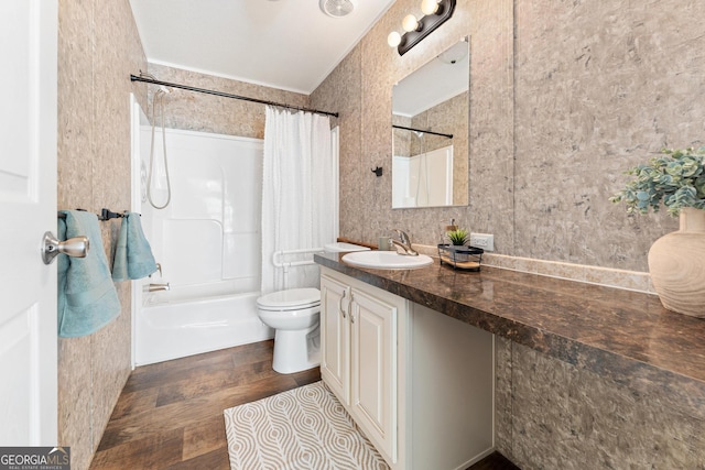 full bath featuring vanity, shower / tub combo, toilet, and wood finished floors