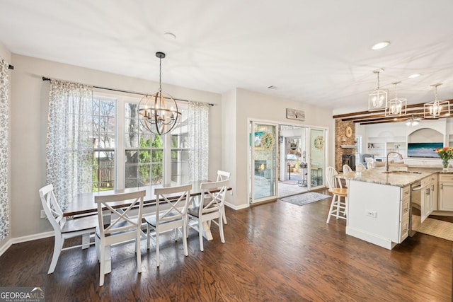 dining area featuring a chandelier and dark wood-style flooring