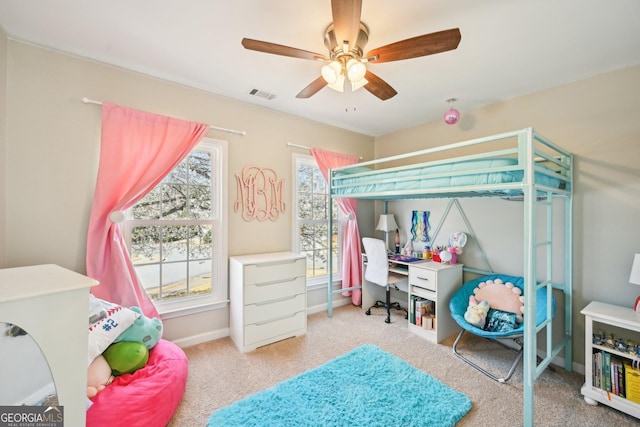 carpeted bedroom featuring baseboards, visible vents, and ceiling fan