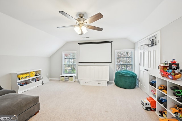 rec room featuring visible vents, lofted ceiling, a ceiling fan, carpet floors, and baseboards