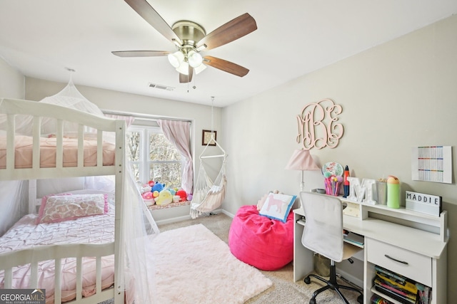 carpeted bedroom featuring visible vents, ceiling fan, and baseboards