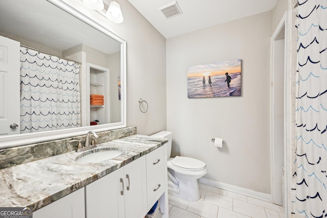 bathroom with visible vents, curtained shower, baseboards, toilet, and vanity