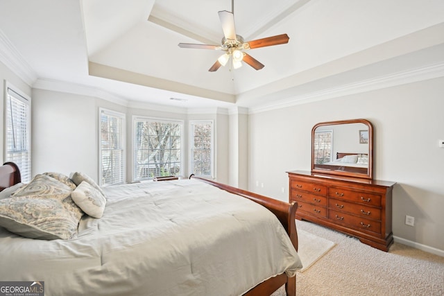 bedroom featuring a ceiling fan, baseboards, crown molding, a raised ceiling, and light colored carpet