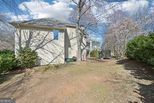 view of property exterior featuring a trampoline