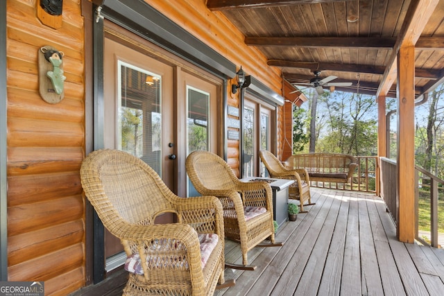 wooden deck featuring french doors and ceiling fan