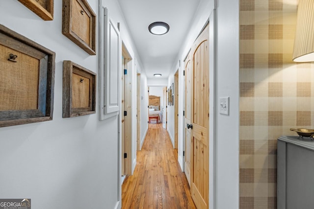 hallway with light wood-style floors