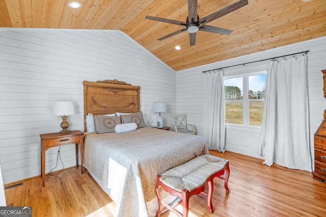 bedroom with visible vents, light wood-style flooring, a ceiling fan, wooden ceiling, and lofted ceiling