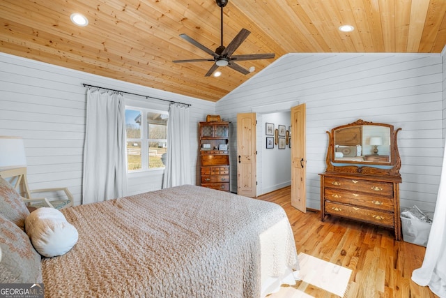 bedroom with wood ceiling, a ceiling fan, light wood-style floors, and vaulted ceiling