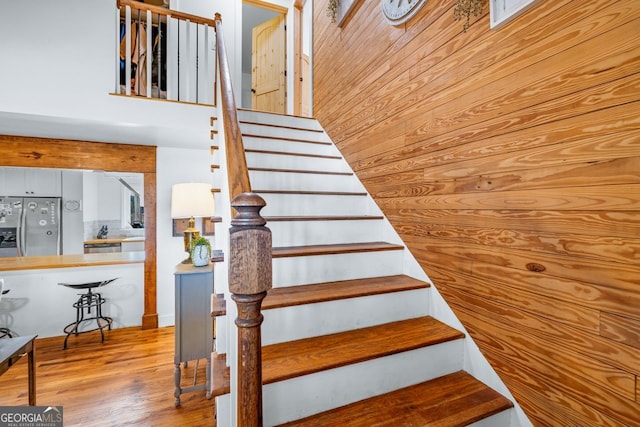 stairway with wood finished floors