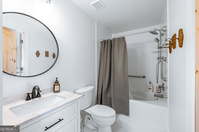 bathroom featuring visible vents, toilet, vanity, and shower / bath combination with curtain