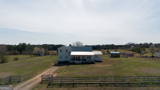 birds eye view of property with a rural view