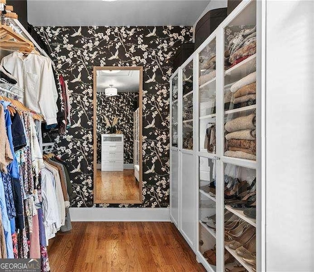 spacious closet with wood finished floors